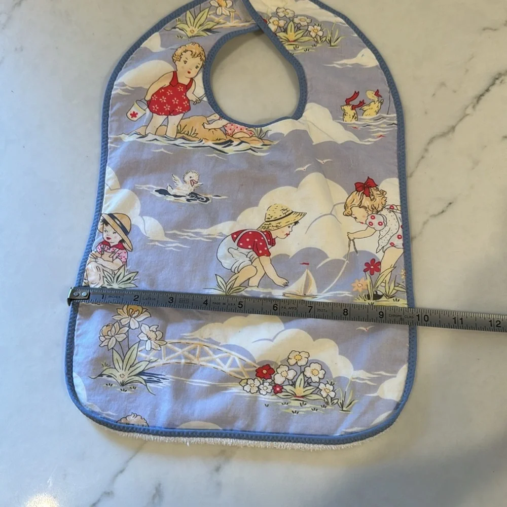 Adorable vintage beach print bib with terry backing